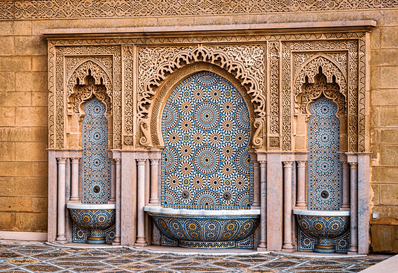 Home Beautiful Moroccan mosaic tile wall with fountains, showcasing intricate designs and cultural artistry.